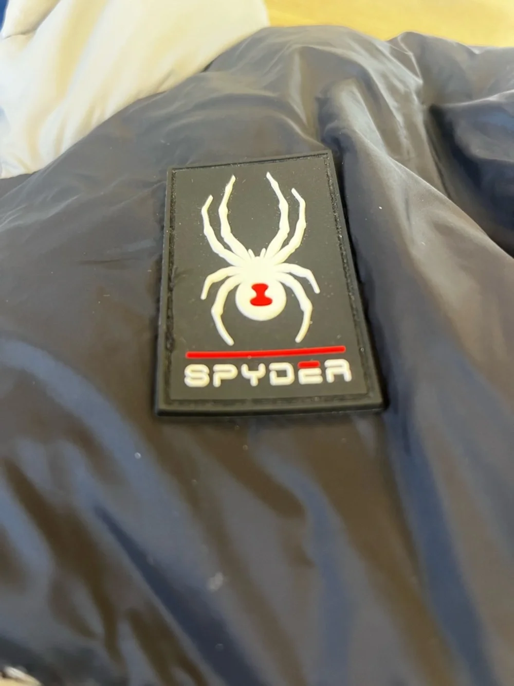Spyder Navy & White Puffer Jacket with Red Accent Logo